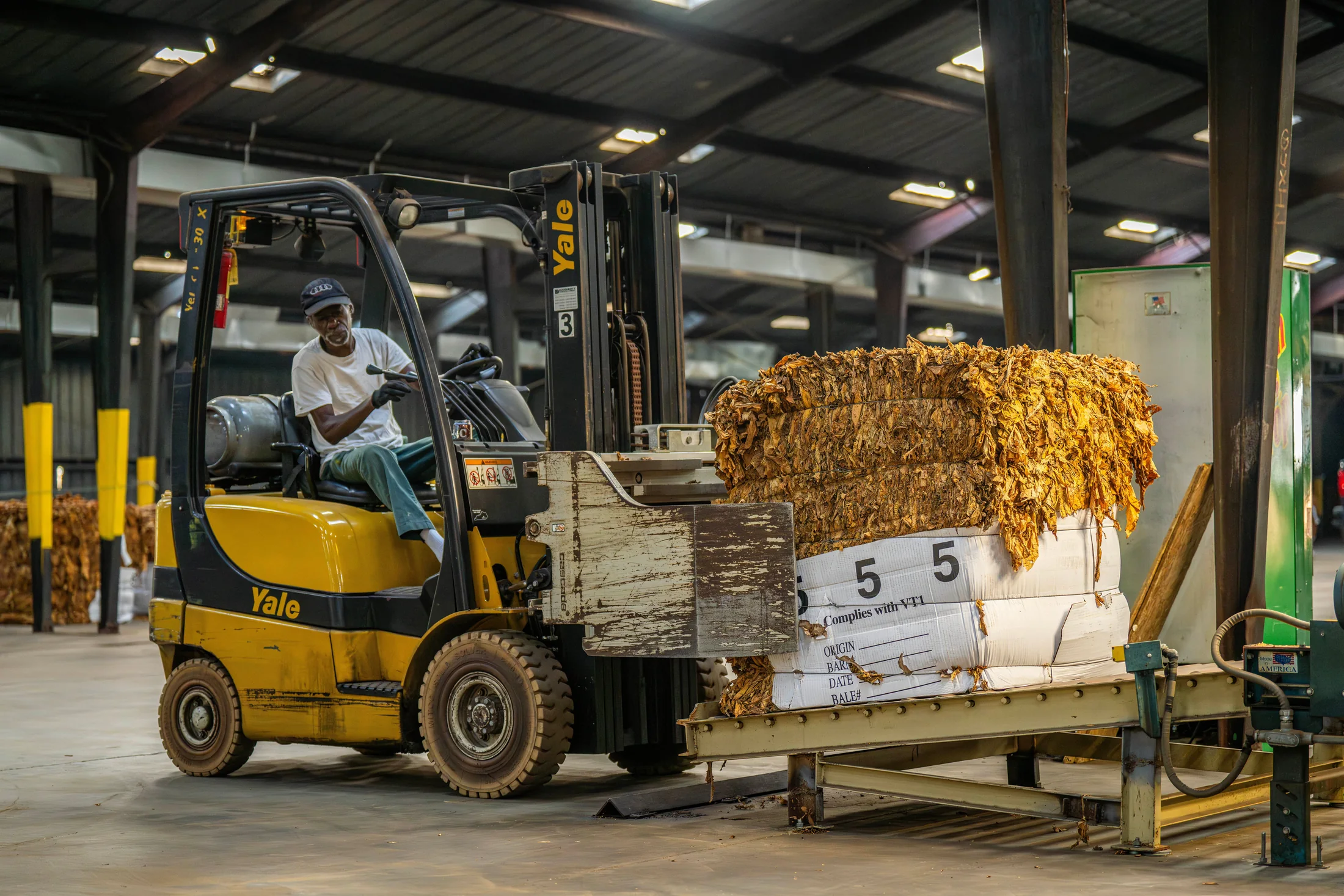 Warehouse worker handling cargo on the floor